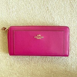 Coach cross grain leather wallet in cranberry.